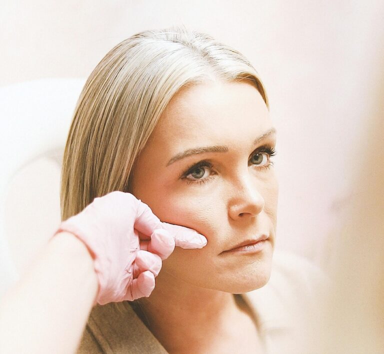 Close-up of a woman receiving a cosmetic injection at a modern beauty clinic.