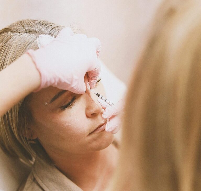 Close-up of a woman receiving a cosmetic injection at a modern beauty clinic.